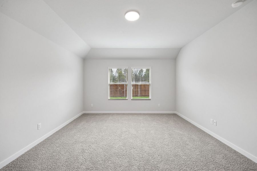 Primary Suite in the Heisman home plan by Trophy Signature Homes – REPRESENTATIVE PHOTO