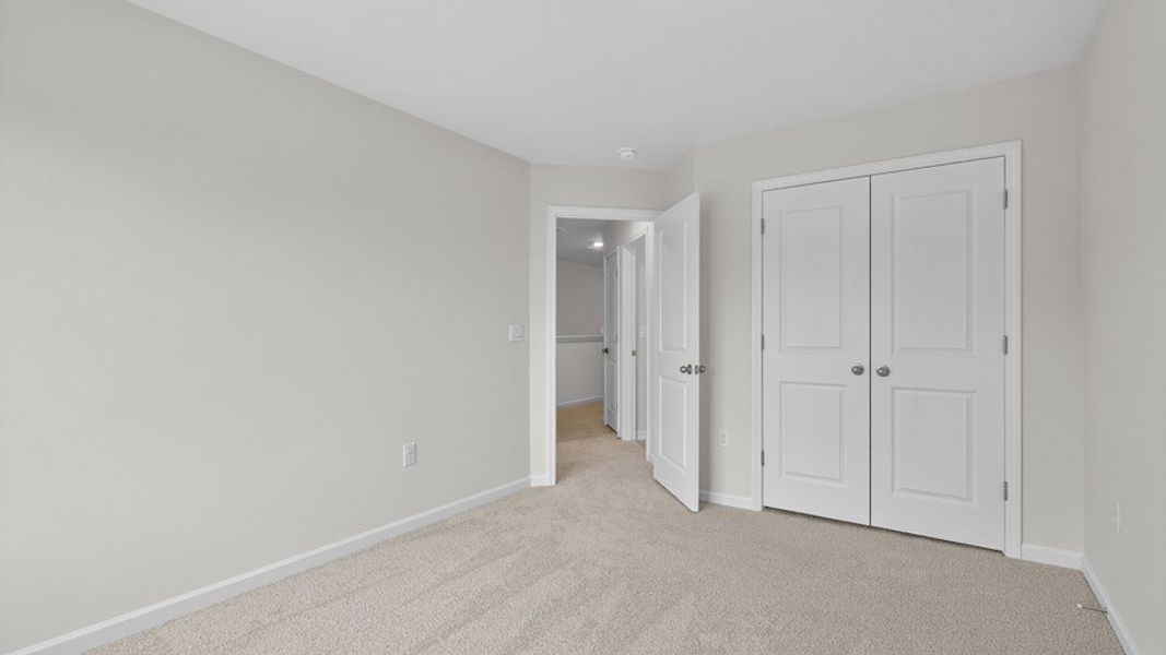 Spacious, unfurnished interior of a new home in The Townes at Anderson Farm, Wendell (Image 22).