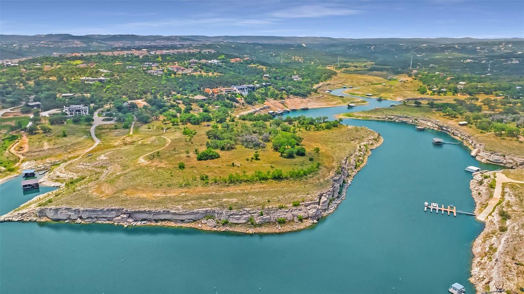 This extraordinary 11-acre estate offers over 1,400 feet of panoramic shoreline.