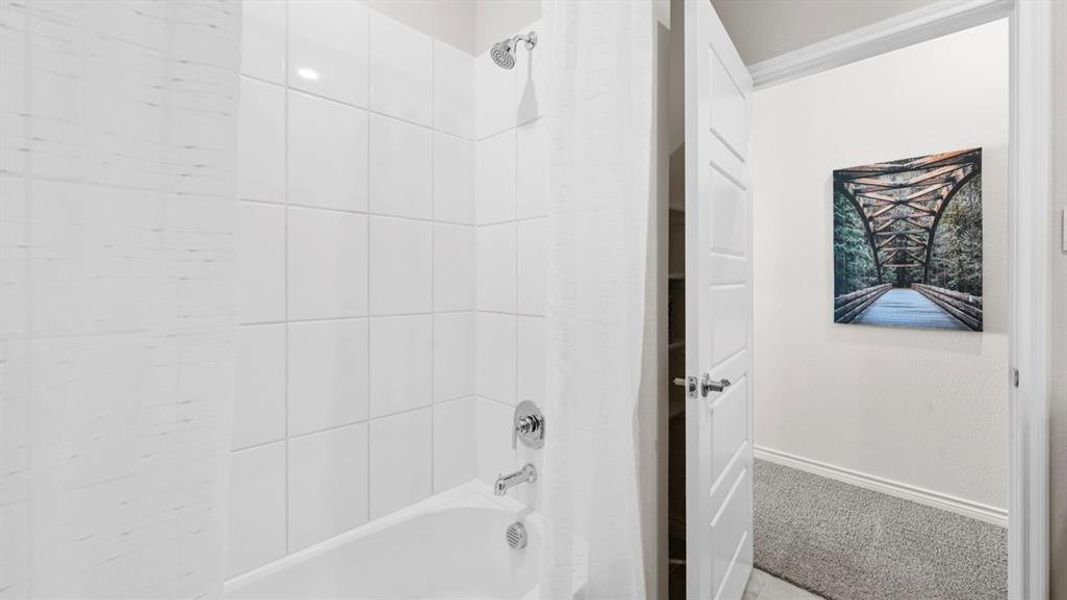 Full bath with shower / tub combination and carpet floors