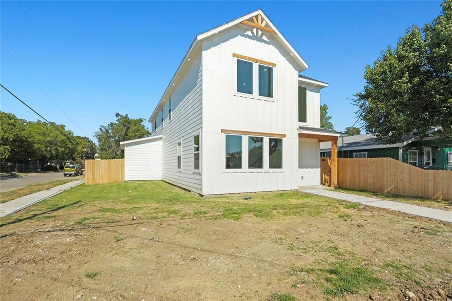 Rear view of property with board and batten siding Rear view of property with board and batten siding