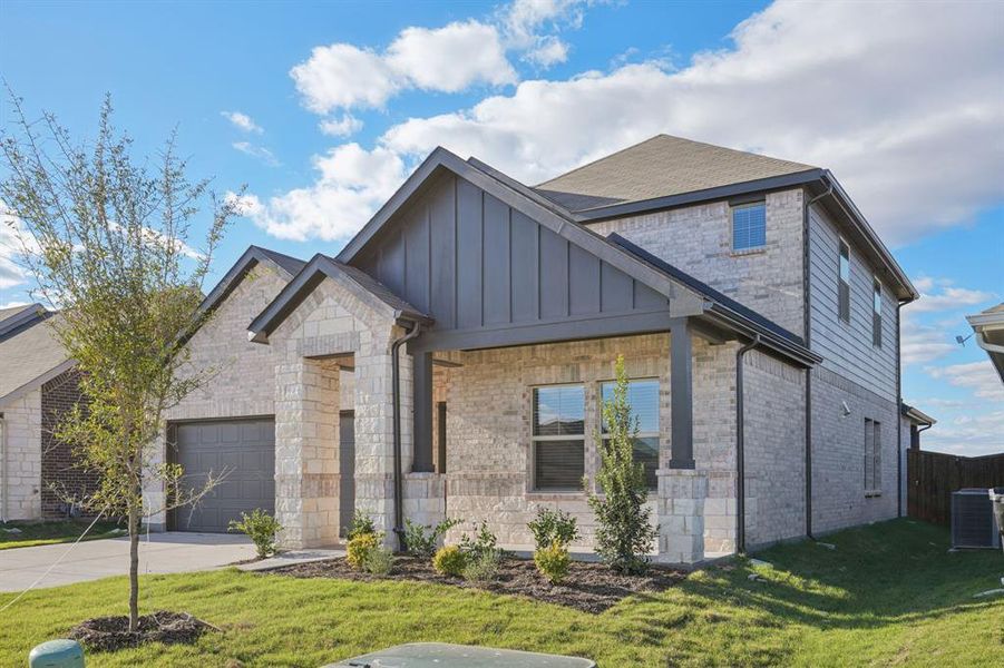 Front exterior of a new home in River Ridge, Crandall, TX, highlighting curb appeal (Image 2). Front exterior of a new home in River Ridge, Crandall, TX, highlighting curb appeal (Image 2).