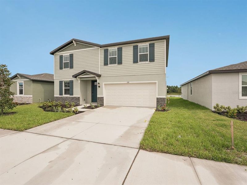 Exterior details and patio area of a home in Magnolia Bay - Classic Series, Nokomis (Image 2). Exterior details and patio area of a home in Magnolia Bay - Classic Series, Nokomis (Image 2).