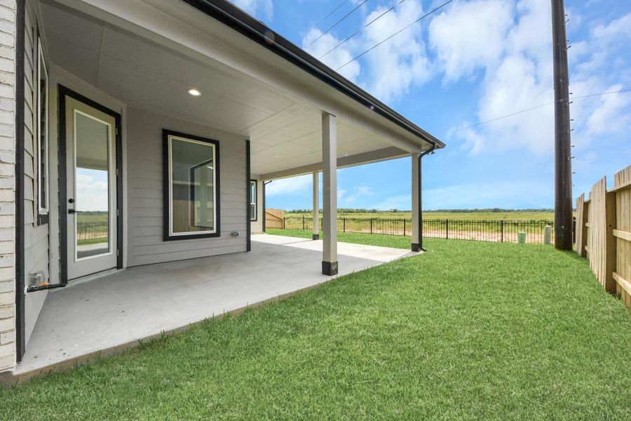 Experience outdoor living at its finest on this expansive covered patio, thoughtfully designed for BBQs and delightful outdoor dining. Experience outdoor living at its finest on this expansive covered patio, thoughtfully designed for BBQs and delightful outdoor dining.