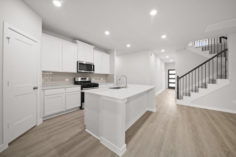 Furnished interior view inside a new home in Sunterra, Katy (Image 4).