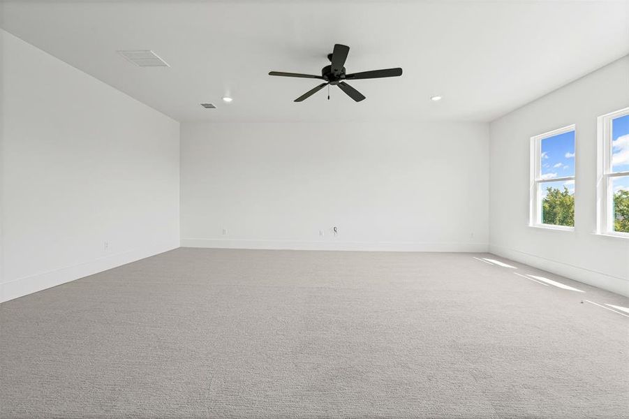 Carpeted spare room featuring recessed lighting and a ceiling fan Carpeted spare room featuring recessed lighting and a ceiling fan