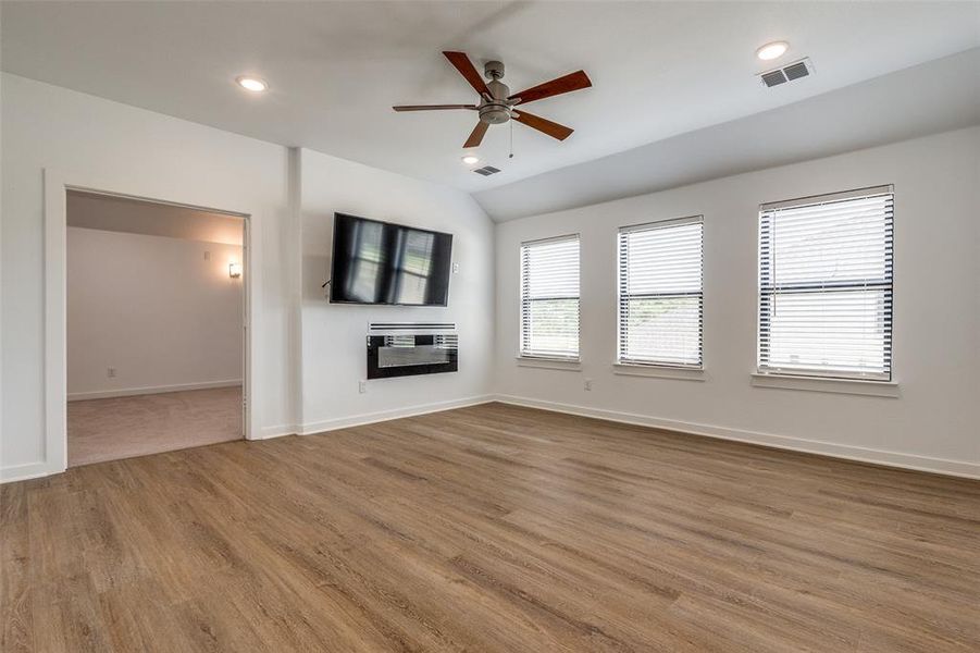 Upstairs game room that opens into additional living space