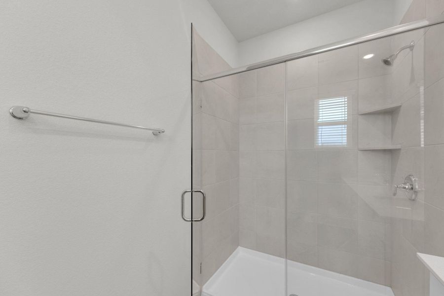 Bathroom featuring a shower stall