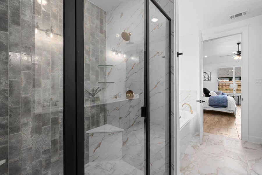 Ensuite bathroom with light marble finish floors, a bath, a marble finish shower, and ceiling fan