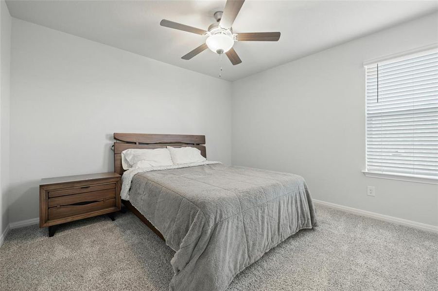 Spacious Secondary Bedroom Upstairs with Ceiling Fan.