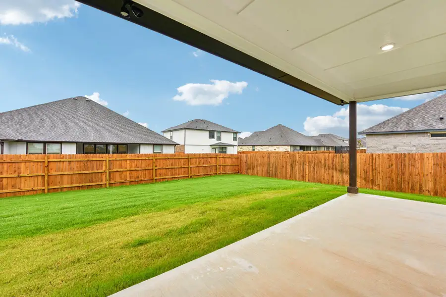 A spacious backyard awaits, fully fenced for privacy and outdoor enjoyment. A spacious backyard awaits, fully fenced for privacy and outdoor enjoyment.