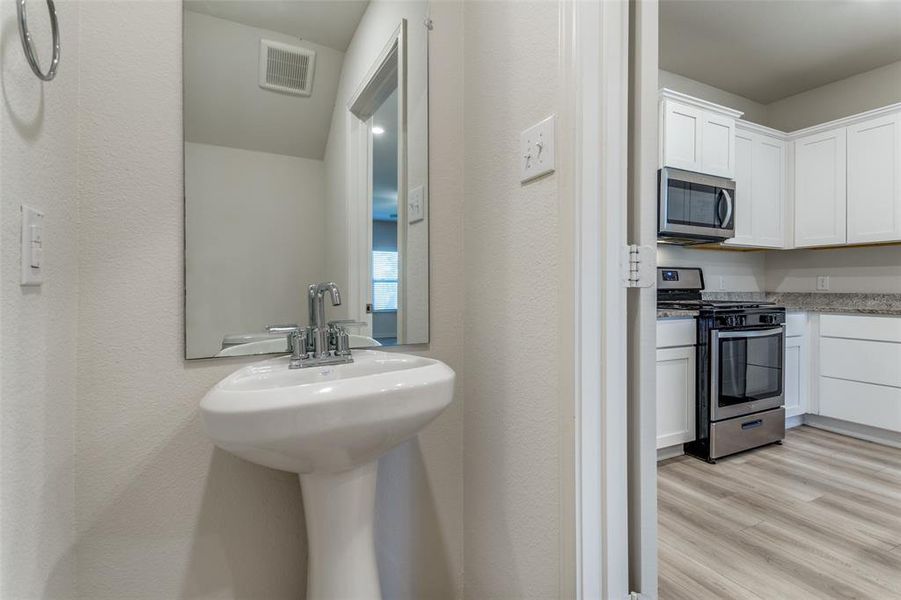 Bathroom featuring wood-type flooring