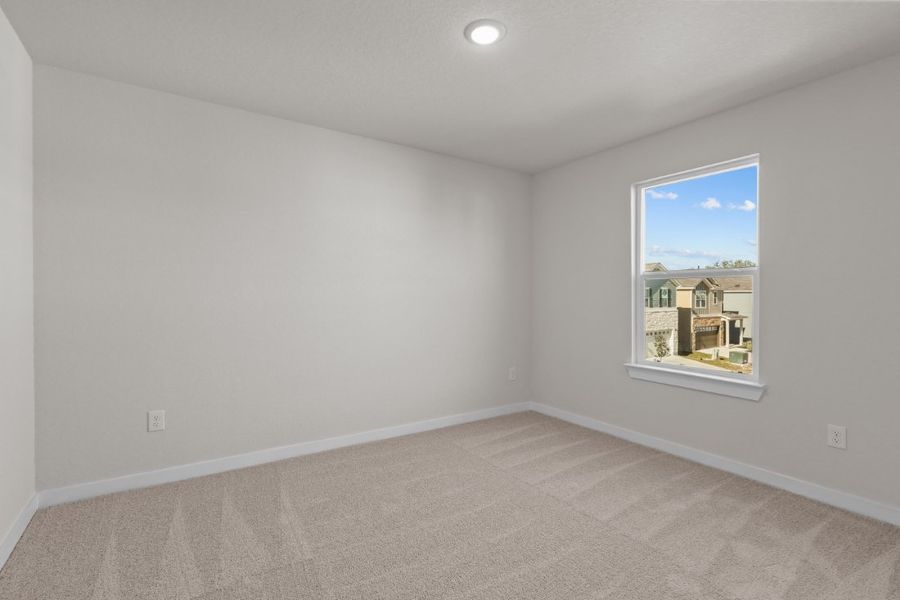 A room with a window and a carpet. A room with a window and a carpet.