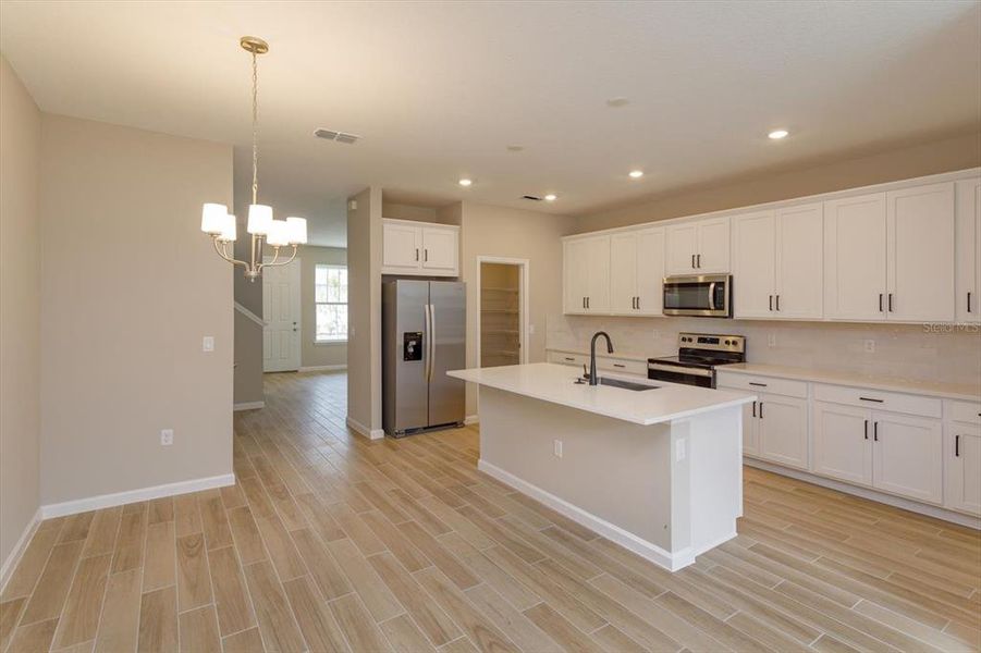 Furnished interior view inside a new home in Serenade at Ovation, Winter Garden (Image 13).
