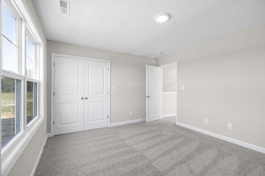 Representative unfurnished interior of a home built from the Magnolia by Caviness & Cates Communities in Bartlett Manor, Youngsville (Image 206).