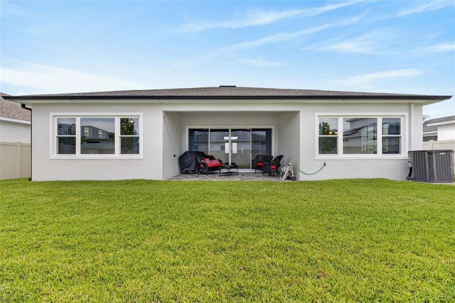 Exterior details and patio area of a home in Robin's Cove at Epperson, Wesley Chapel (Image 35).