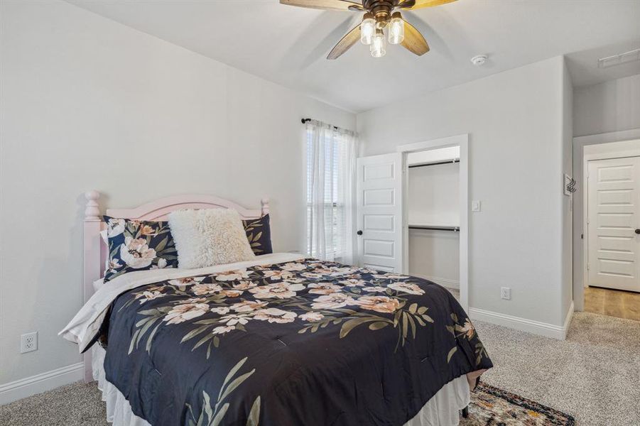 Bedroom with carpet flooring and ceiling fan