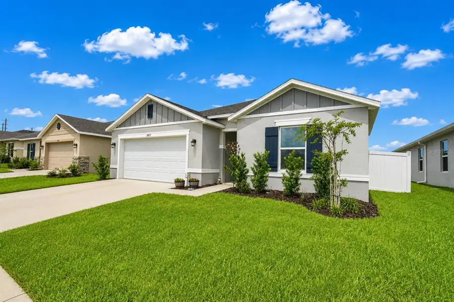 Front exterior of a new home in , Haines City, FL, highlighting curb appeal (Image 22). Front exterior of a new home in , Haines City, FL, highlighting curb appeal (Image 22).