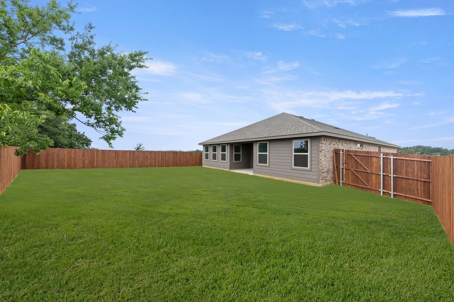 Front exterior of a new home in Belmont, Aubrey, TX, highlighting curb appeal (Image 27). Front exterior of a new home in Belmont, Aubrey, TX, highlighting curb appeal (Image 27).