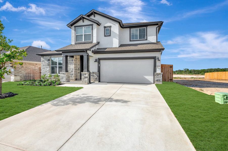 Front exterior of a new home in Davis Ranch 50', San Antonio, TX, highlighting curb appeal (Image 22).