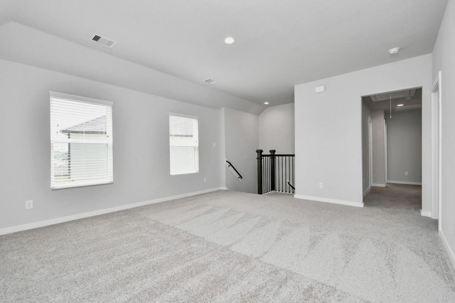 discover a haven of leisure in this fantastic game room! Whether you're seeking a casual hangout or an adult gaming retreat, this space has it all. Sample photo of completed home with similar floor plan. Actual colors and selections may vary.