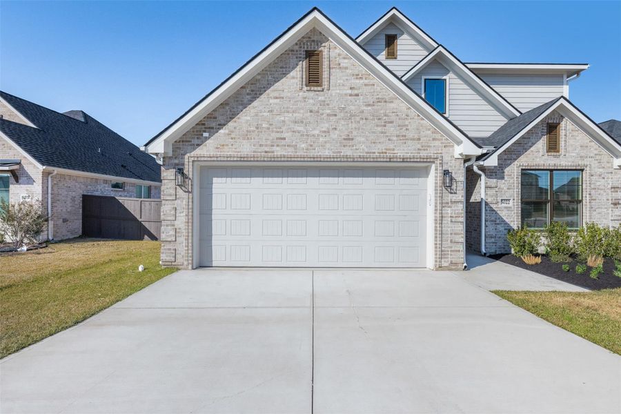 Front exterior of a new home in , Bryan, TX, highlighting curb appeal (Image 27).