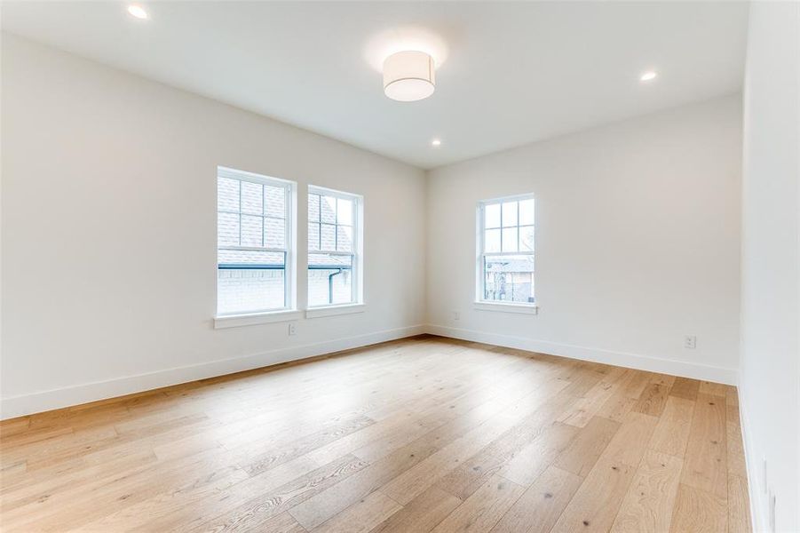 Unfurnished room with light hardwood / wood-style flooring