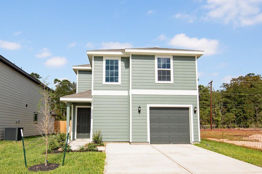 Front exterior of a new home in Townsend Reserve, Splendora, TX, highlighting curb appeal (Image 2). Front exterior of a new home in Townsend Reserve, Splendora, TX, highlighting curb appeal (Image 2).