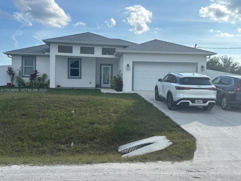 Front exterior of a new home in , Labelle, FL, highlighting curb appeal (Image 5).