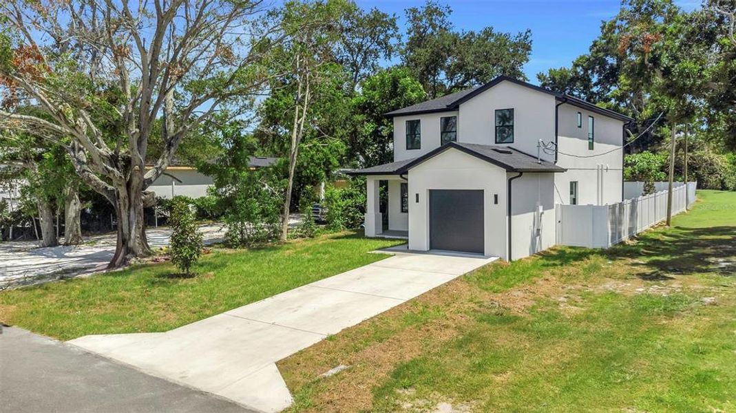 Front exterior of a new home in , St. Petersburg, FL, highlighting curb appeal (Image 1). Front exterior of a new home in , St. Petersburg, FL, highlighting curb appeal (Image 1).
