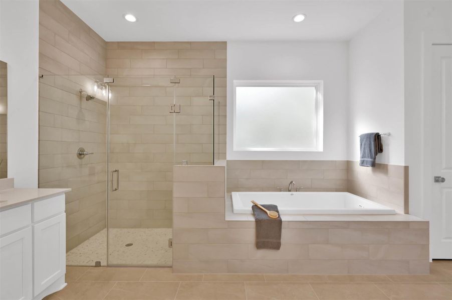 Custom walk-in shower and garden tub look inviting. Custom walk-in shower and garden tub look inviting.