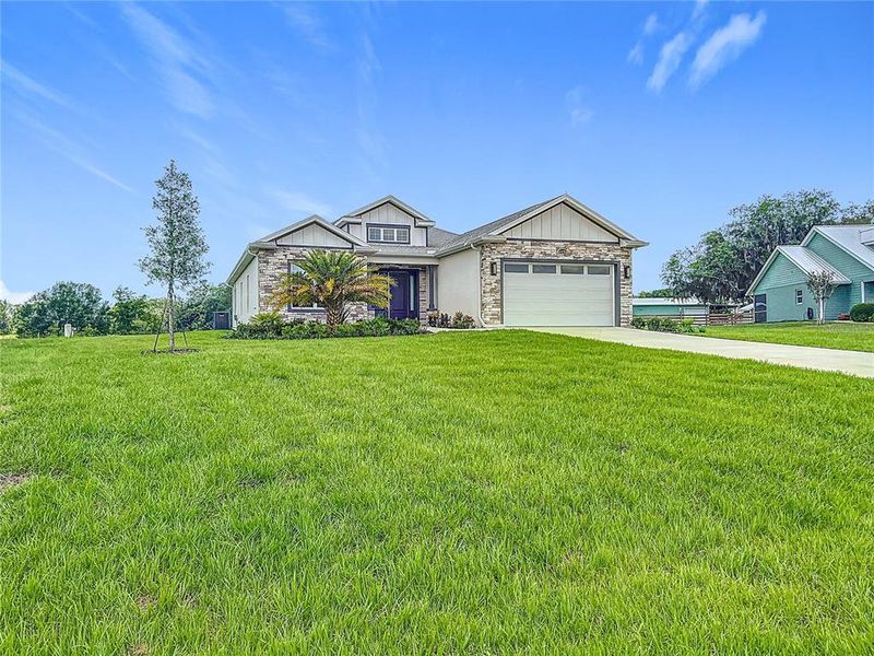 Front exterior of a new home in , Wildwood, FL, highlighting curb appeal (Image 25).