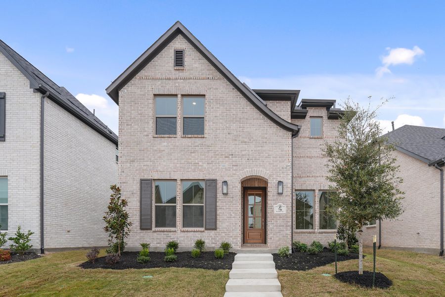 Front exterior of a new home in Light Farms Brenham - 40' Lots, Celina, TX, highlighting curb appeal (Image 1). Front exterior of a new home in Light Farms Brenham - 40' Lots, Celina, TX, highlighting curb appeal (Image 1).