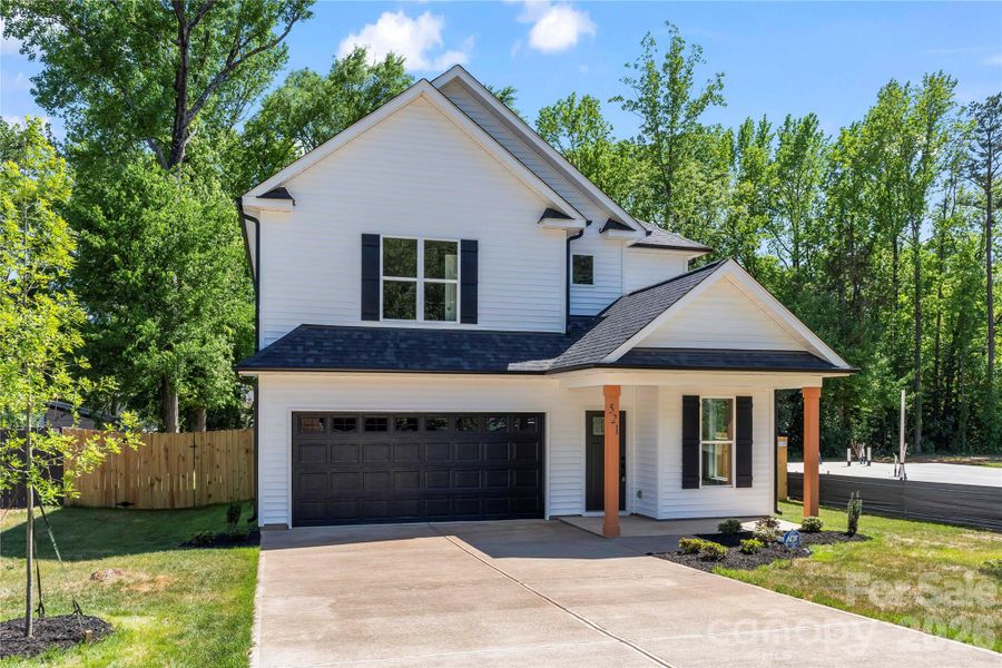 Front exterior of a new home in , Charlotte, NC, highlighting curb appeal (Image 23).