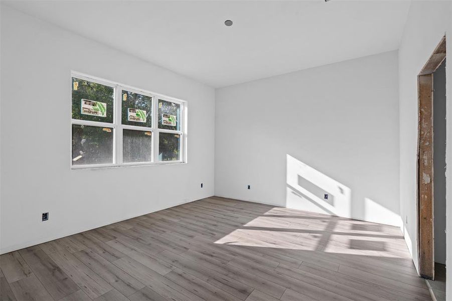 Spare room with wood finished floors Spare room with wood finished floors