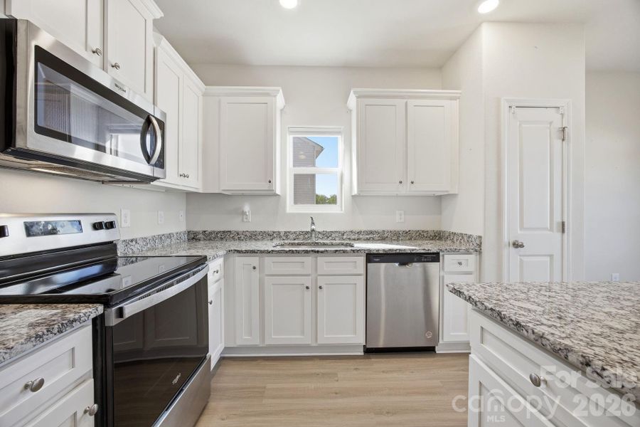 Furnished interior view inside a new home in Stagecoach Station, Gastonia (Image 9).
