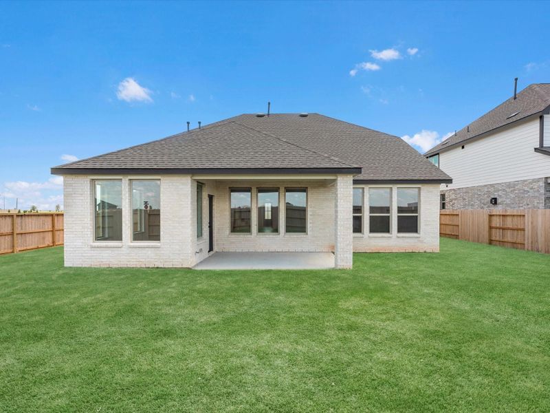 Exterior details and patio area of a home in Sunterra, Katy (Image 3).