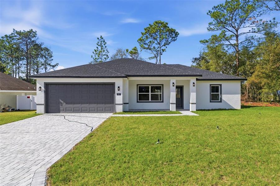 Front exterior of a new home in , Citrus Springs, FL, highlighting curb appeal (Image 20). Front exterior of a new home in , Citrus Springs, FL, highlighting curb appeal (Image 20).