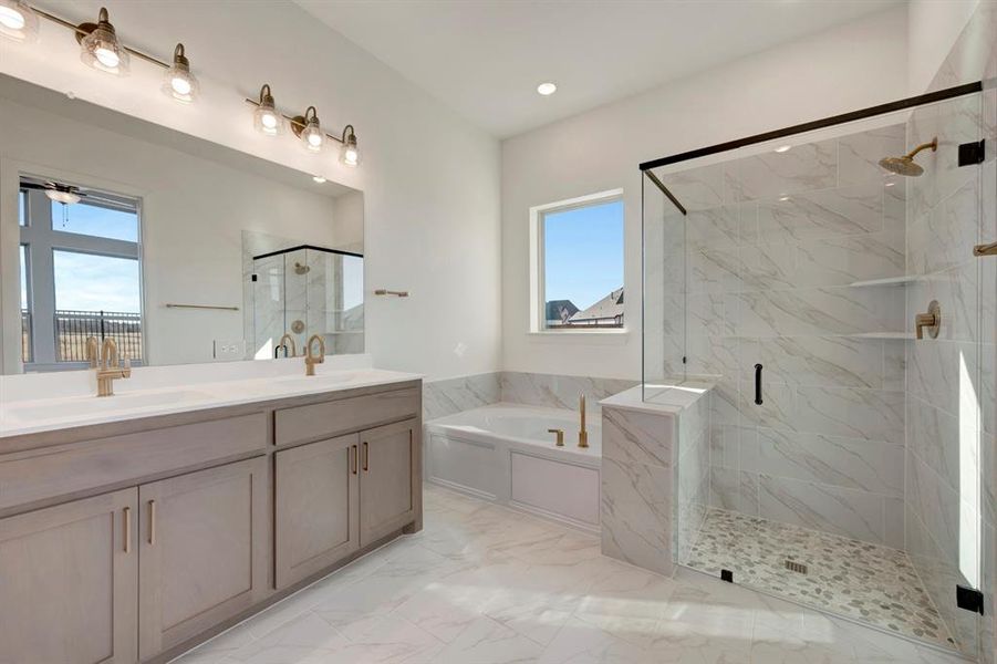 Full bath with double vanity, a marble finish shower, and a garden tub Full bath with double vanity, a marble finish shower, and a garden tub