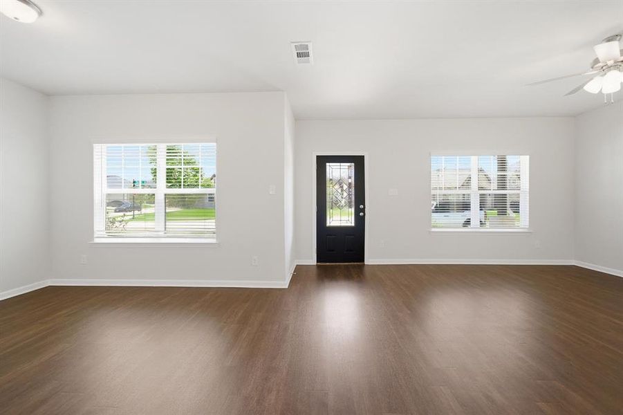 Spacious interior with rich wood-finish flooring
