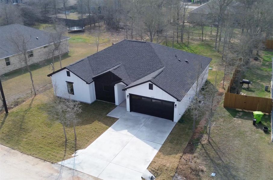 Front exterior of a new home in , Bastrop, TX, highlighting curb appeal (Image 22).