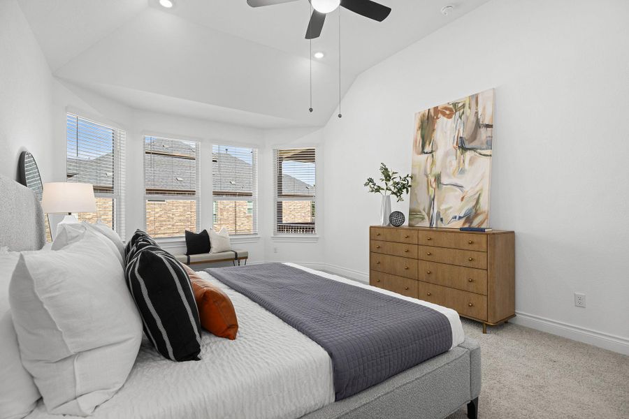 Carpeted bedroom featuring vaulted ceiling, recessed lighting, and ceiling fan