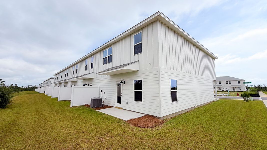Exterior details and patio area of a home in Salt Creek Townhomes at Mexico Beach, Mexico Beach (Image 18).