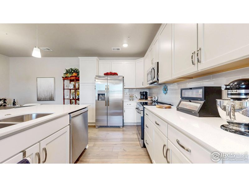 Furnished interior view inside a new home in The Lakes at Centerra - Discovery, Loveland (Image 11).