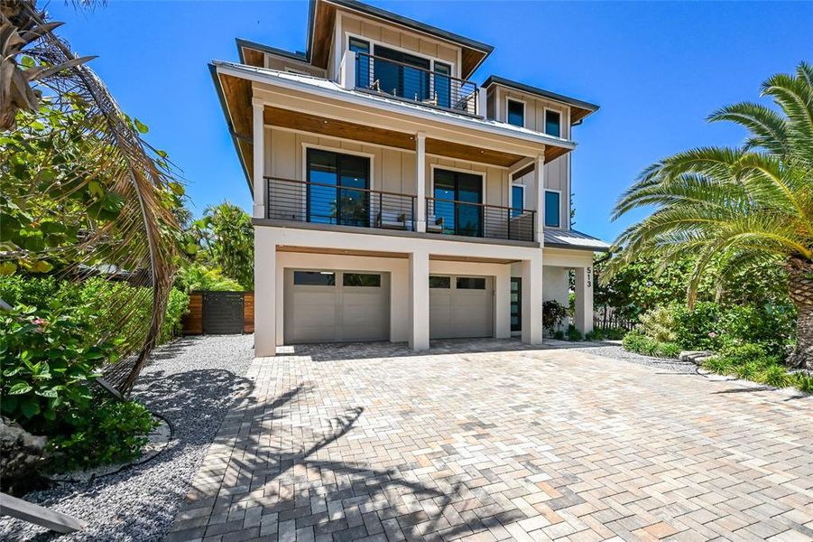Front exterior of a new home in , Anna Maria, FL, highlighting curb appeal (Image 2). Front exterior of a new home in , Anna Maria, FL, highlighting curb appeal (Image 2).