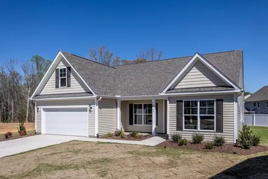 Front exterior of a new home in Daniel Farms, Benson, NC, highlighting curb appeal (Image 2).