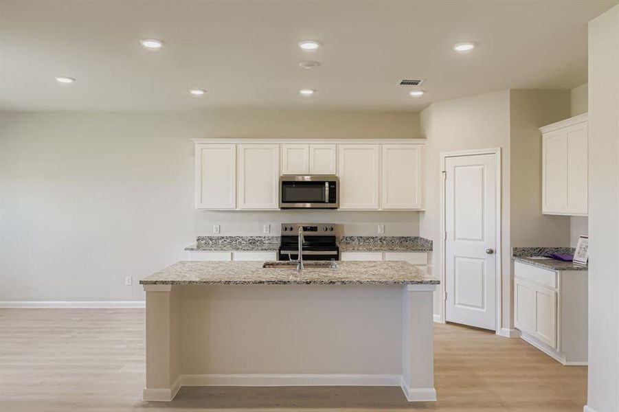 Furnished interior view inside a new home in Sperling Farms, Ferris (Image 7).