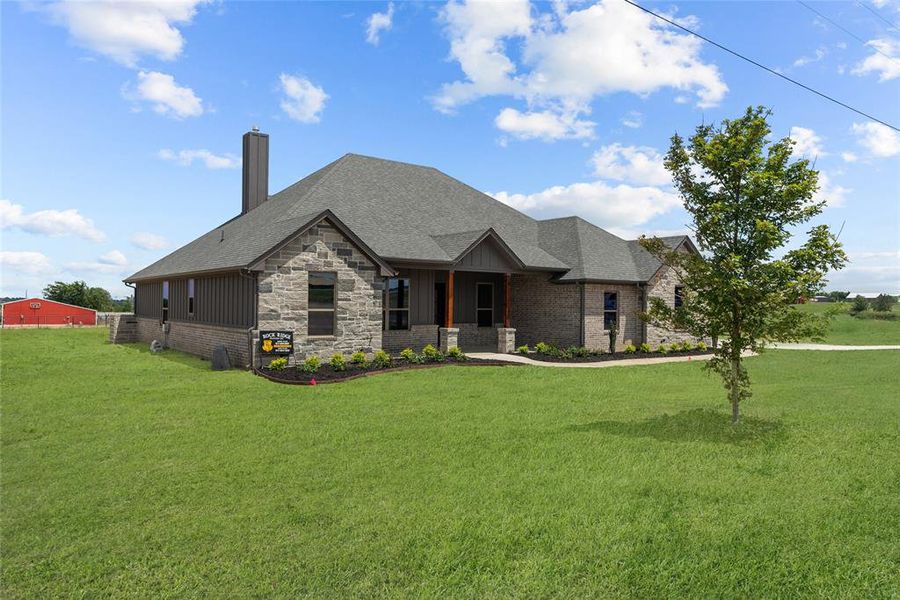 View of front of house with a front yard