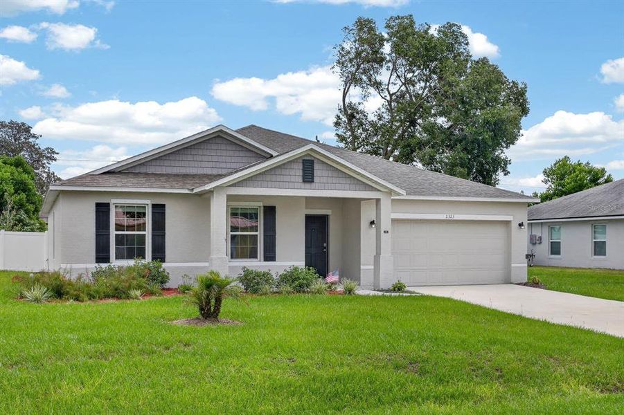 Front exterior of a new home in , Edgewater, FL, highlighting curb appeal (Image 1). Front exterior of a new home in , Edgewater, FL, highlighting curb appeal (Image 1).