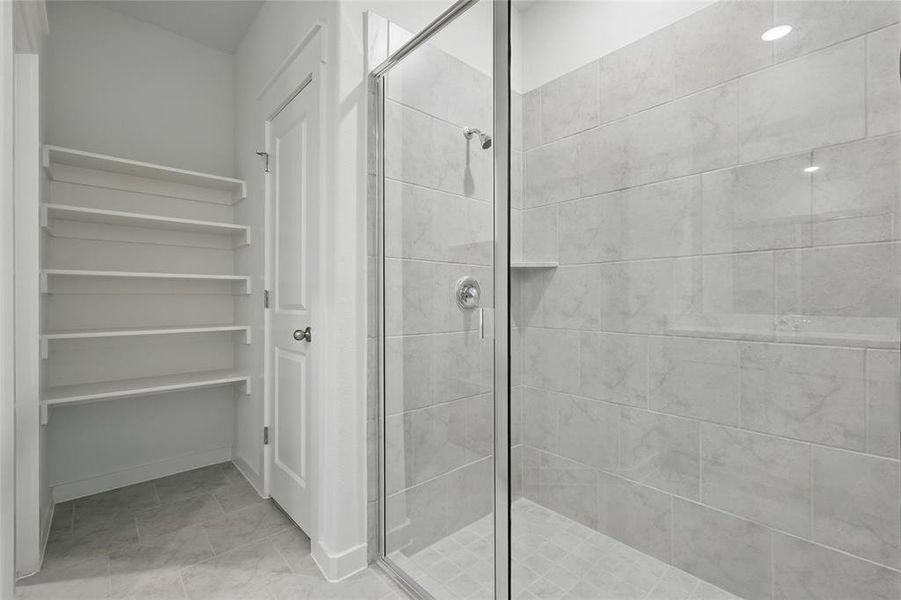Bathroom with a stall shower and a spacious closet Bathroom with a stall shower and a spacious closet